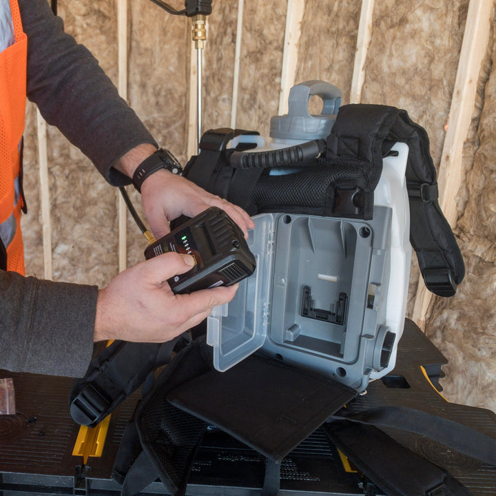 hands checking indicator lights on lithium-ion battery pack
